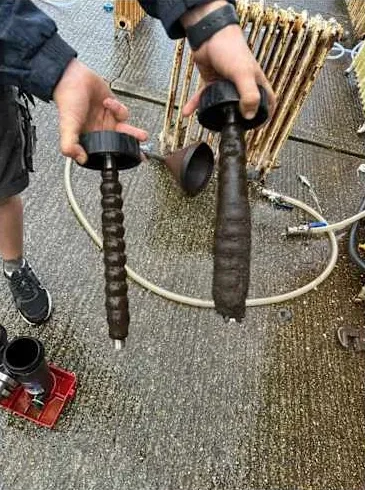 Magnet rods covered in sludge from one of our jobs